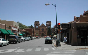 Fig. 4. Looking east down San Francisco Street towards the cathedral. The cathedral stands on the site of the original parish church built there in 1625, and San Francisco Street is one of the streets of the seventeenth-century town of Santa Fe.