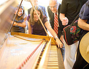 3. After a concert, audience members get a closer look at a spinet at Anderson House, home of the Society of the Cincinnati, Washington, D.C., 2011. The spinet is a reproduction of an English model, c. 1720, from the shop of Thomas Hitchcock in London. Photograph courtesy of David and Ginger Hildebrand.