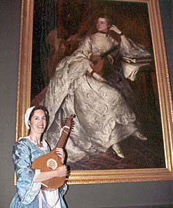 4. Ginger poses with a reproduction English guitar at the National Gallery of Art, Washington, D.C., 2010. The Thomas Gainsborough painting dates from 1760 and is of Anne Ford, a high-society amateur guitarist who assumed a rather risqué pose for her day. Photograph courtesy of David and Ginger Hildebrand.