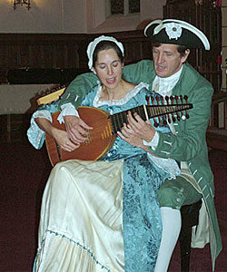 5. David and Ginger performing John Dowland's "Come Again, Sweet Love," as arranged for four hands on one lute, Summit, New Jersey, 2005. We are careful not to present the lute as a typical colonial instrument, since it wasn't, but instead use it to contrast the earliest American musical forms with the elevated music of the English court in 1607, such as that heard in this madrigal. Photograph courtesy of David and Ginger Hildebrand.