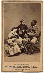 Fig. 12. Photographer unknown: Wilson [Chinn], Charley, Rebecca, and Rosa ("Learning Is Wealth"), carte de visite, c. 1863. Collection of Greg French.