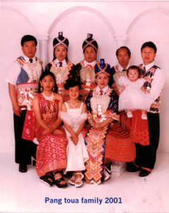 Fig. 3. Yang/Vang family members, 2001. Pang Toua Yang standing second from right; Mai Yang standing third from right, Elizabeth Young seated far right, Michael Wong standing far right. Courtesy Pang Toua Yang. 