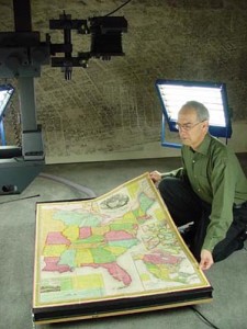 Fig. 4. David Rumsey preparing a map for scanning