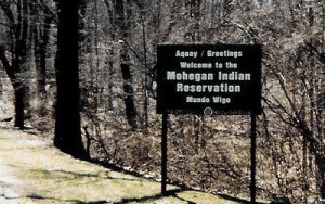 Fig. 1. Sign posted at the boundary of the Mohegan Reservation in Uncasville, Connecticut, greets visitors in both Mohegan and English: "Mundo Wigo" / "The Creator is Good." Photograph by the author.