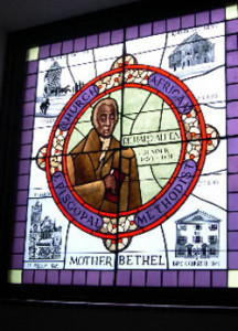 Fig. 2. This beautiful piece of Allen iconography—a stained glass window—is situated on the south side of Bethel church, on the stairway leading to the Richard Allen Museum. Courtesy of the author.