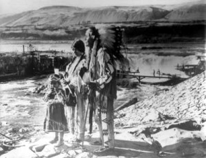 This photograph was taken in 1955 on Chief Tommy Thompson’s one-hundredth birthday, two years before the falls were drowned. Selected by acclamation in 1875, he was salmon chief at Celilo Falls for the next eighty-four years. Flora, Tommy’s fiery and outspoken last wife, and her granddaughter, Linda, stand with him. Photo taken by L. Foster, from the collection of Wilma Roberts.