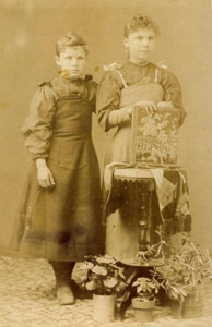Fig. 1. Embossed albums used as scrapbooks were often valued possessions. Girls with album, circa 1880s. Author's collection.