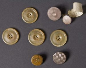 Fig. 4. Buttons from Watson's relic box. The labeled buttons are Thomas Willing's. The rest are unknown. Courtesy of the Winterthur Museum.